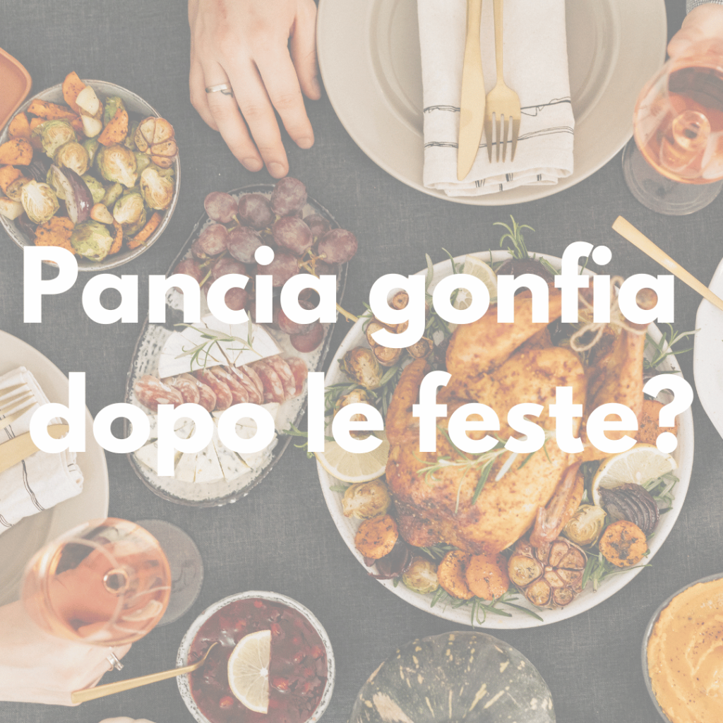 Pancia gonfia dopo le feste: tavola natalizia con cibi abbondanti