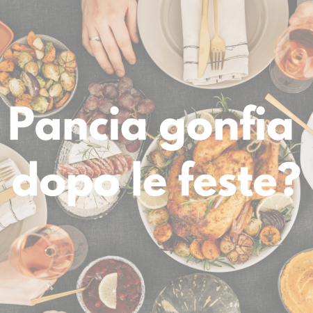 Pancia gonfia dopo le feste: tavola natalizia con cibi abbondanti